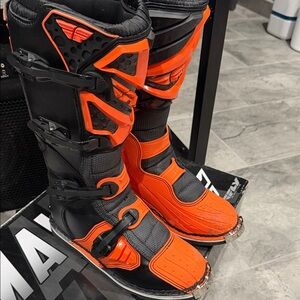 Vibrant Orange and Black Riding Boots